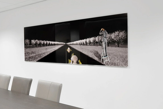 Visual artists such as Carina Dumais here often opt for the photo glued behind plexiglass.