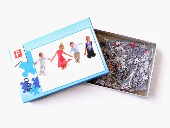 The photo gift photo puzzle with the A4 boxes with your own print and lost pieces in the boxes.